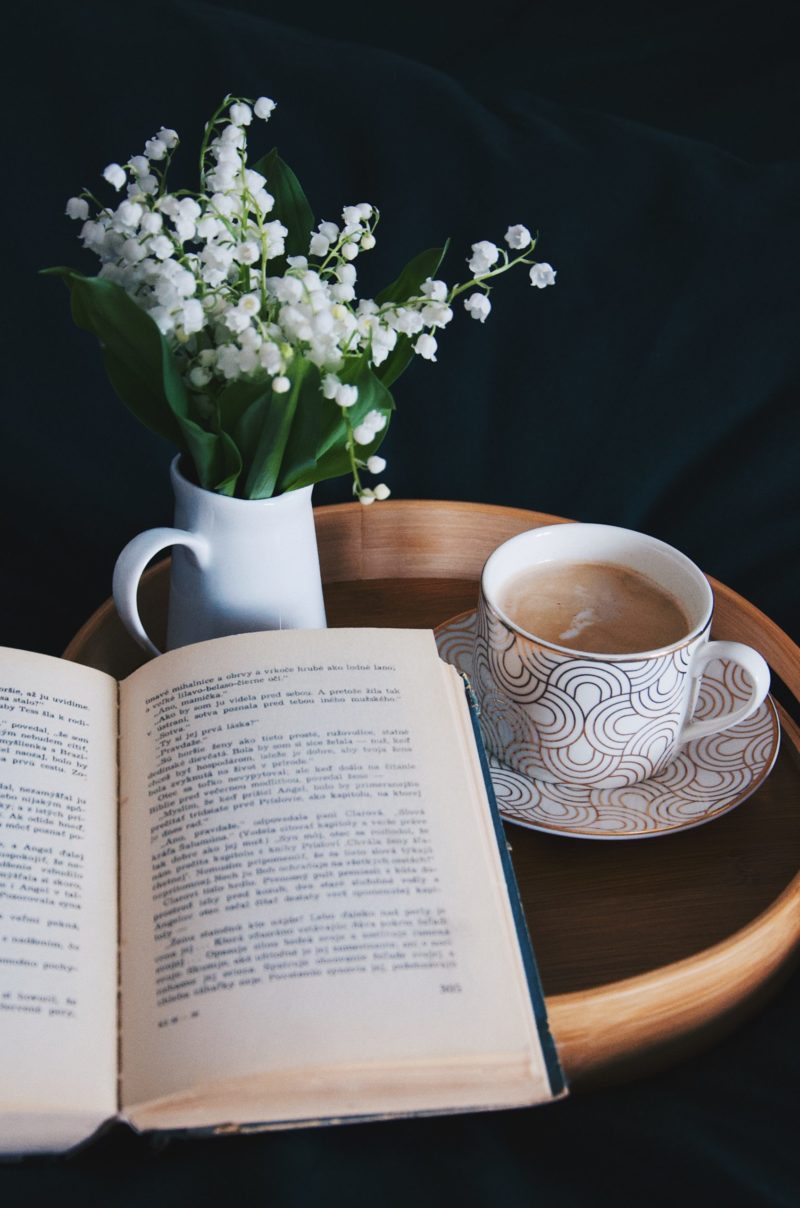 teacup, novel and lily of the valley